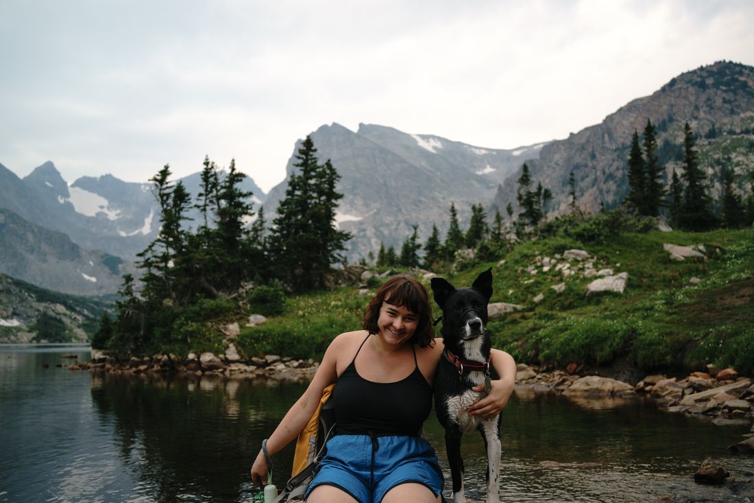 Resting by an alpine lake with one of our rescue dogs